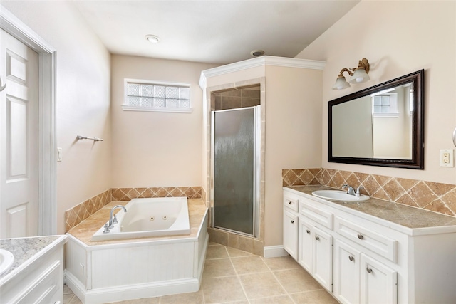 108 Harbour Town Cir, Conroe, TX 77356 - full bathroom featuring tile patterned floors, vanity, a jetted tub, and a stall shower