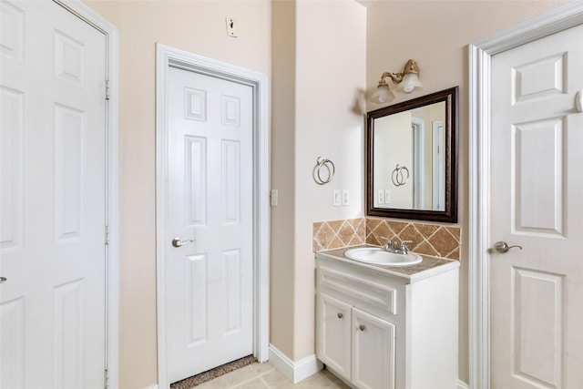 108 Harbour Town Cir, Conroe, TX 77356 - bathroom featuring baseboards, vanity, tile patterned flooring, and tasteful backsplash
