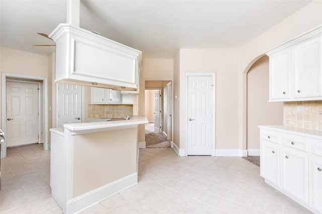 108 Harbour Town Cir, Conroe, TX 77356 - kitchen featuring light countertops, tasteful backsplash, white cabinetry, and light tile patterned floors