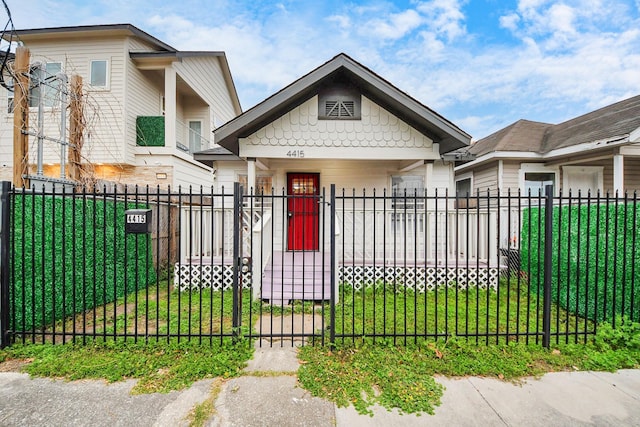 4415 Hershe St, Houston, TX 77020 - view of front facade with a gate, a front yard, and a fenced front yard