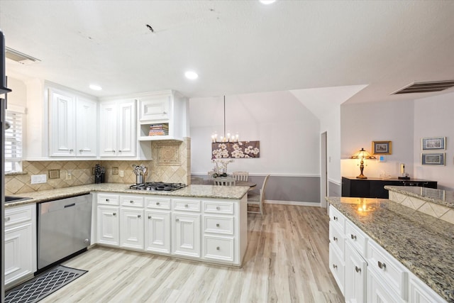 1807 Emerald Green Dr, Houston, TX 77094 - kitchen featuring appliances with stainless steel finishes, light wood-style floors, white cabinetry, and recessed lighting