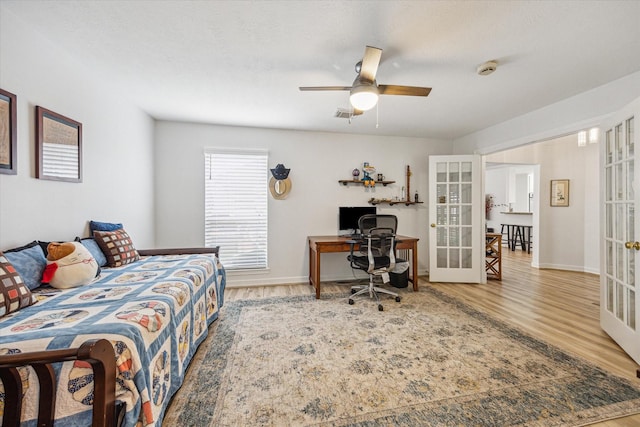 1807 Emerald Green Dr, Houston, TX 77094 - bedroom featuring french doors, a desk, wood finished floors, and baseboards
