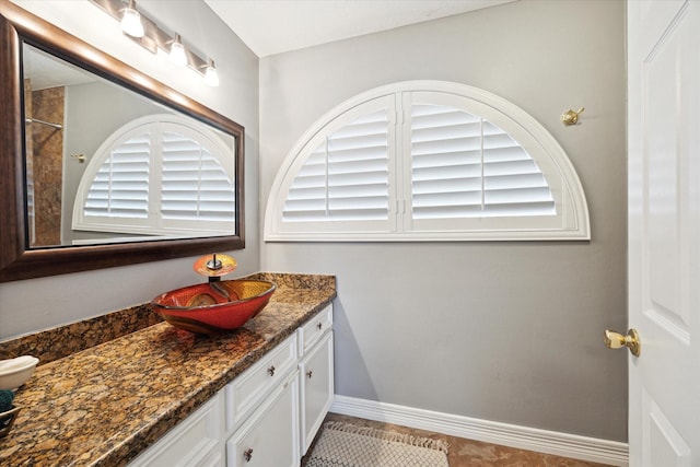 1807 Emerald Green Dr, Houston, TX 77094 - bathroom featuring vanity, tile patterned flooring, and baseboards