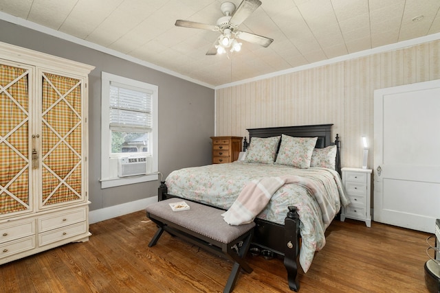 bedroom featuring crown molding, wood finished floors, cooling unit, ceiling fan, and baseboards