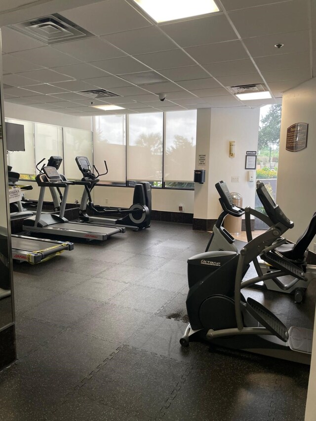 3525 Sage Rd Unit 1204, Houston, TX 77056 - gym with baseboards, a drop ceiling, and visible vents