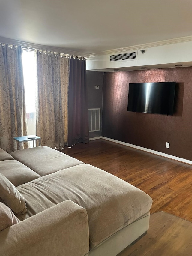 3525 Sage Rd Unit 1204, Houston, TX 77056 - bedroom with wood finished floors, visible vents, and crown molding