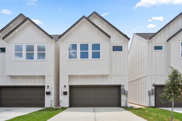 7228 Ave B, Houston, TX 77011 - modern farmhouse style home featuring an attached garage, driveway, and board and batten siding