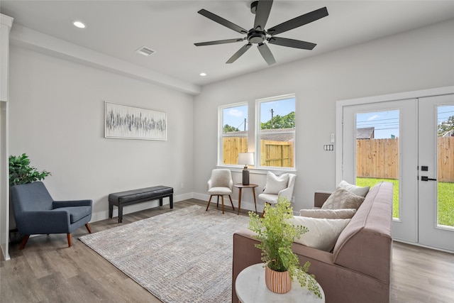living area featuring wood finished floors, recessed lighting, ceiling fan, and baseboards