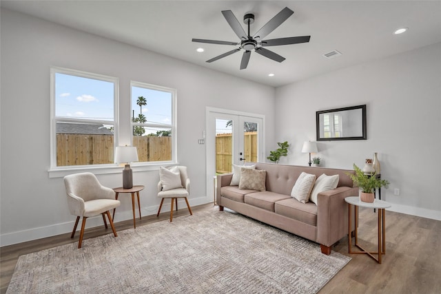 7228 Ave B, Houston, TX 77011 - living room featuring wood finished floors, recessed lighting, ceiling fan, and french doors