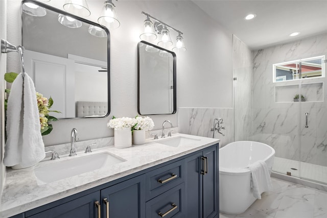7228 Ave B, Houston, TX 77011 - bathroom featuring a marble finish shower, marble look tiles, a freestanding tub, double vanity, and recessed lighting