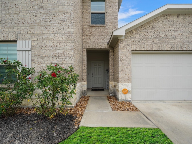 2423 Staverton Cir, Spring, TX 77373 - entrance to property featuring driveway, stone siding, and a garage