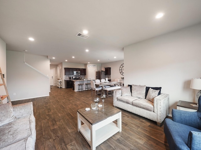 2423 Staverton Cir, Spring, TX 77373 - living area with dark wood-type flooring, stairway, visible vents, and recessed lighting