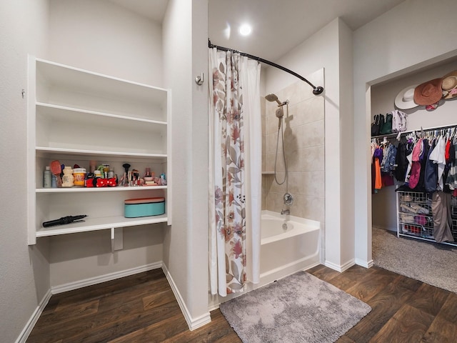 2423 Staverton Cir, Spring, TX 77373 - full bathroom featuring wood finished floors, a spacious closet, baseboards, and shower / bathtub combination with curtain