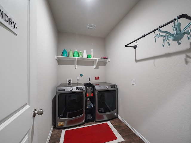 2423 Staverton Cir, Spring, TX 77373 - clothes washing area featuring baseboards, washer and clothes dryer, laundry area, and dark wood-style flooring