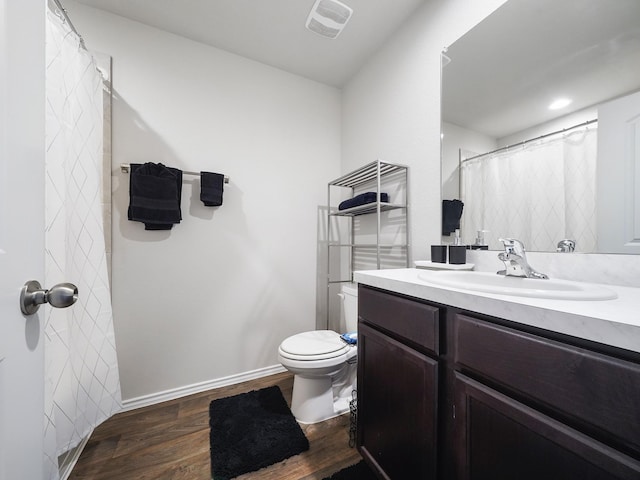 2423 Staverton Cir, Spring, TX 77373 - bathroom with wood finished floors, visible vents, toilet, vanity, and baseboards