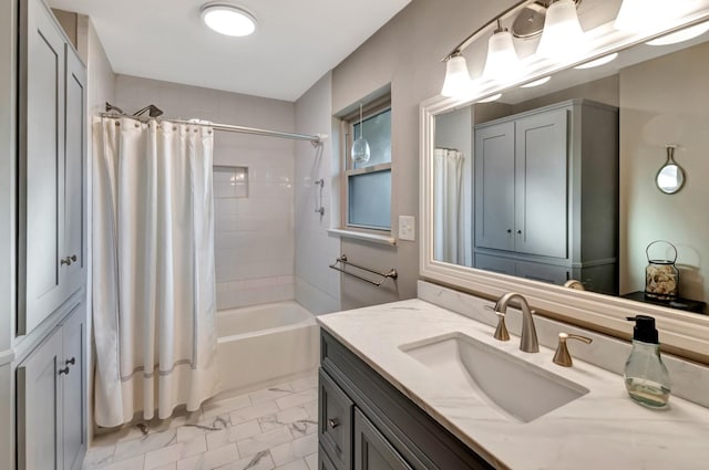 bathroom with shower / tub combo with curtain, marble finish floor, and vanity