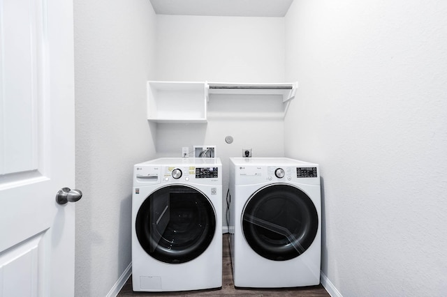 25130 Bells Canyon Dr, Porter, TX 77365 - washroom featuring washer and dryer, laundry area, baseboards, and dark wood-type flooring