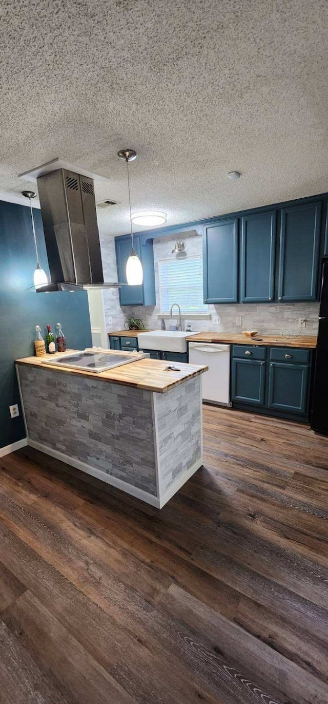 kitchen with a sink, wooden counters, white dishwasher, range hood, and cooktop