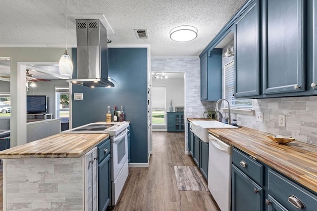 kitchen featuring wooden counters, exhaust hood, white appliances, blue cabinetry, and ceiling fan