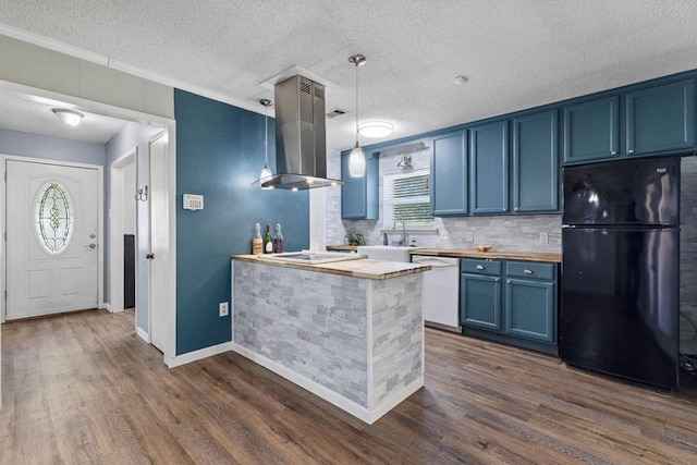 kitchen featuring island exhaust hood, dark wood finished floors, white appliances, blue cabinetry, and butcher block counters