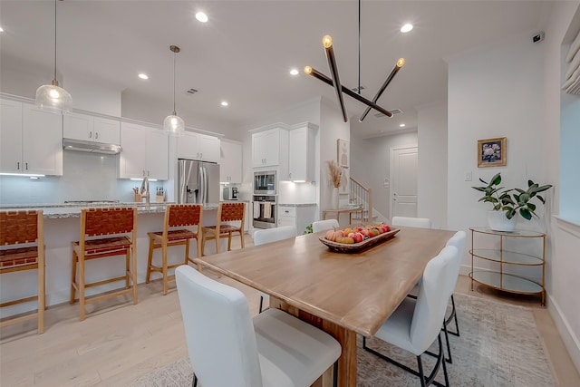 2418 Huldy St Unit B, Houston, TX 77019 - dining area featuring light wood-type flooring, stairway, recessed lighting, and baseboards