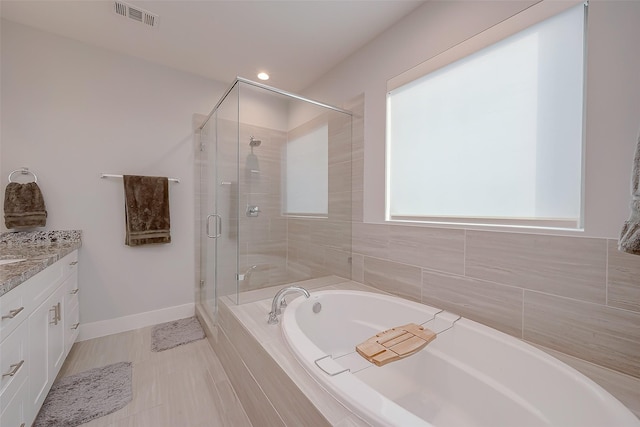 2418 Huldy St Unit B, Houston, TX 77019 - full bathroom with a garden tub, vanity, a shower stall, baseboards, and recessed lighting