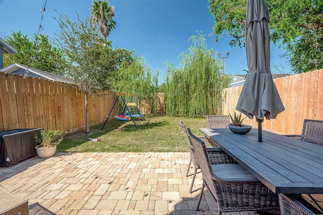2418 Huldy St Unit B, Houston, TX 77019 - view of patio / terrace featuring outdoor dining area and a playground