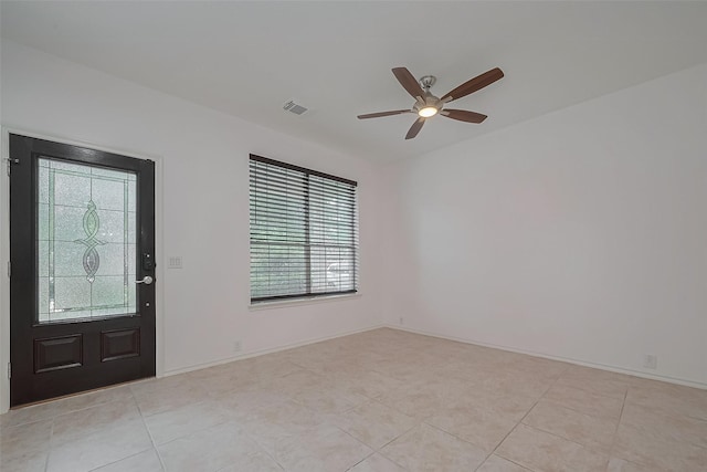24543 Carlton Springs Ln, Katy, TX 77494 - entryway with ceiling fan, light tile patterned flooring, and baseboards