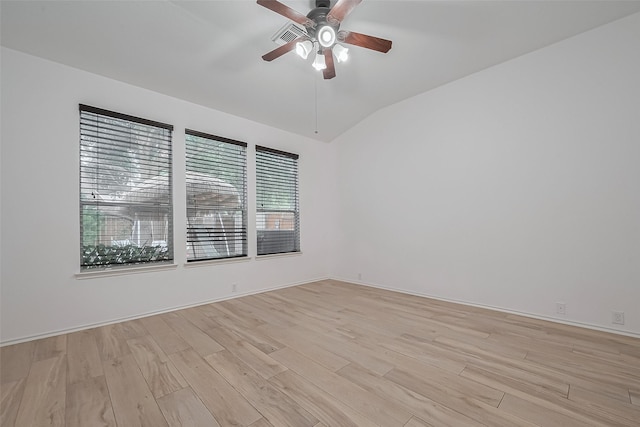 24543 Carlton Springs Ln, Katy, TX 77494 - spare room with light wood-type flooring, vaulted ceiling, ceiling fan, and baseboards