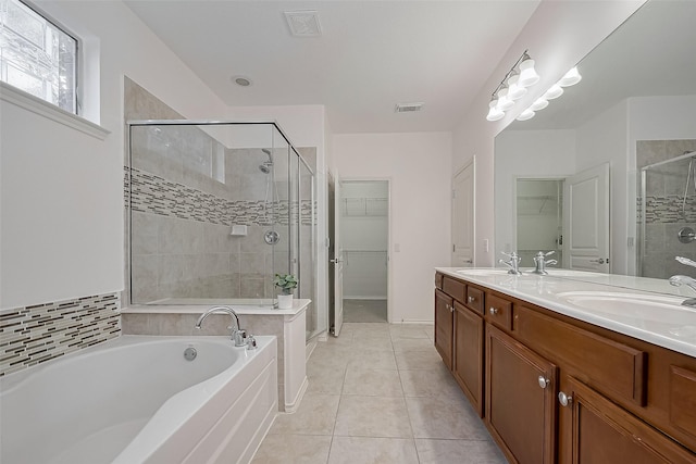 24543 Carlton Springs Ln, Katy, TX 77494 - full bath with a walk in closet, a stall shower, a bath, and double vanity