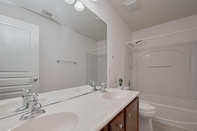 24543 Carlton Springs Ln, Katy, TX 77494 - full bathroom with double vanity, toilet, shower / bathtub combination, and tile patterned flooring