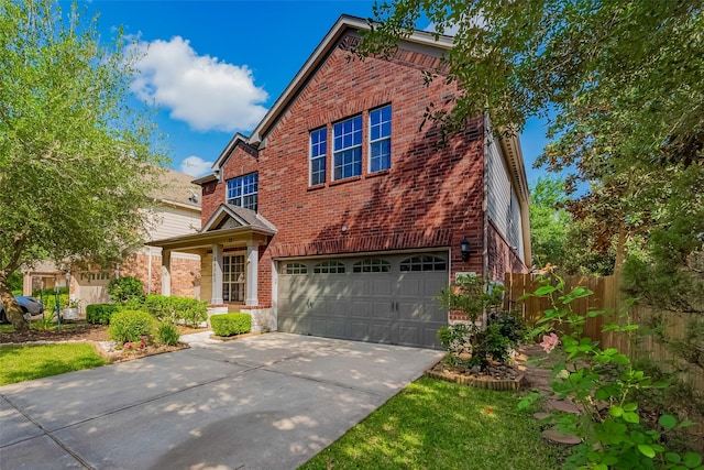 24543 Carlton Springs Ln, Katy, TX 77494 - traditional-style home featuring brick siding, concrete driveway, and an attached garage