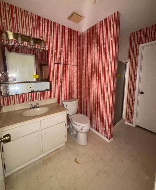 2332 Woodland Park Dr Unit 11, Houston, TX 77077 - full bathroom with wallpapered walls, tile patterned floors, vanity, toilet, and a shower stall