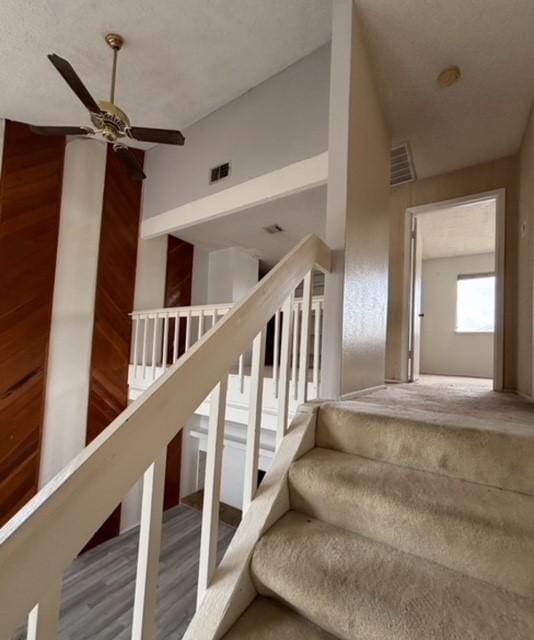 2332 Woodland Park Dr Unit 11, Houston, TX 77077 - stairs featuring ceiling fan, wood finished floors, and lofted ceiling