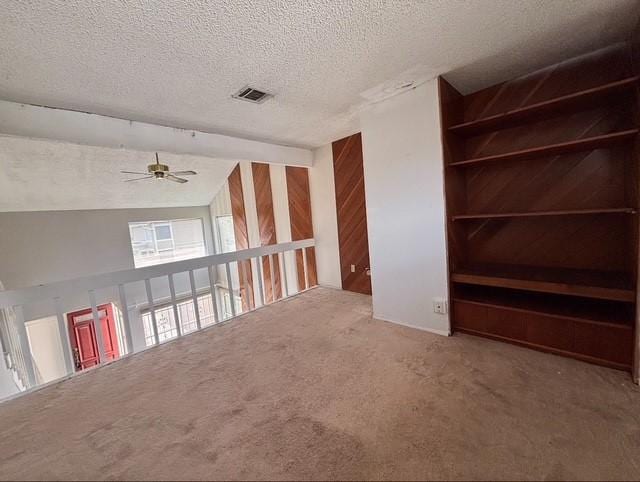 2332 Woodland Park Dr Unit 11, Houston, TX 77077 - spare room featuring a ceiling fan, carpet flooring, a textured ceiling, and lofted ceiling