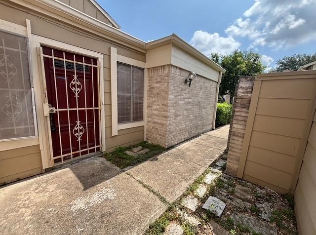 2332 Woodland Park Dr Unit 11, Houston, TX 77077 - property entrance featuring brick siding