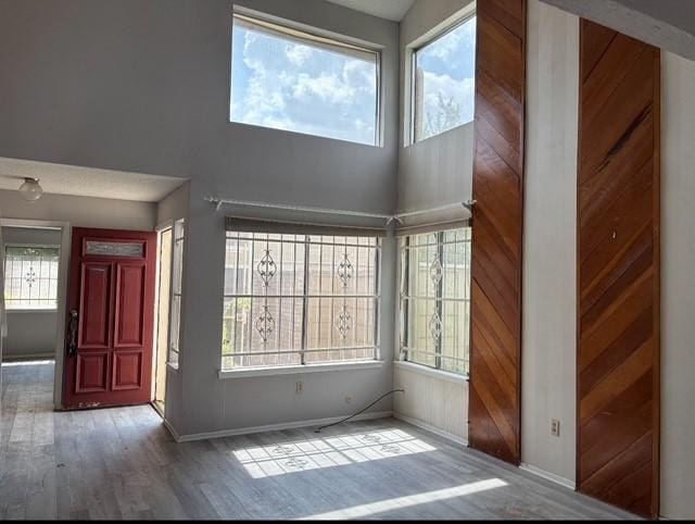 2332 Woodland Park Dr Unit 11, Houston, TX 77077 - foyer featuring baseboards, wood finished floors, and a high ceiling