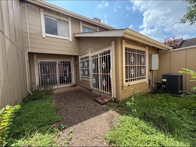 2332 Woodland Park Dr Unit 11, Houston, TX 77077 - rear view of property with central AC