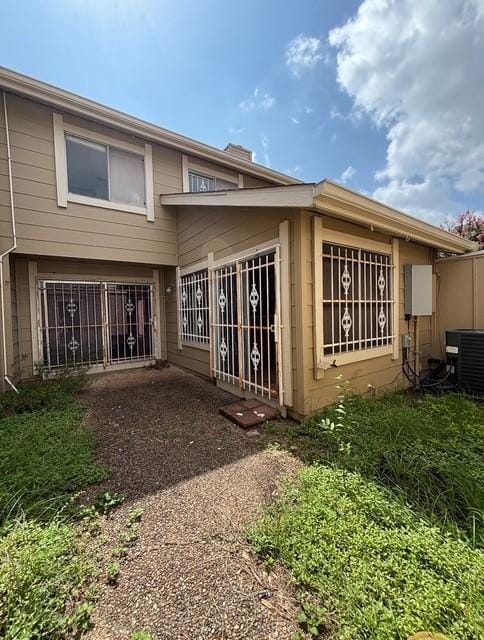 2332 Woodland Park Dr Unit 11, Houston, TX 77077 - back of property featuring central air condition unit