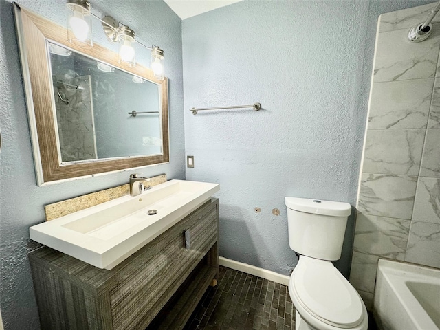 full bath with vanity, toilet, and baseboards