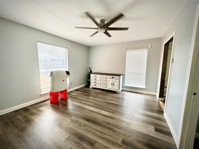 bedroom featuring baseboards, a ceiling fan, and wood finished floors