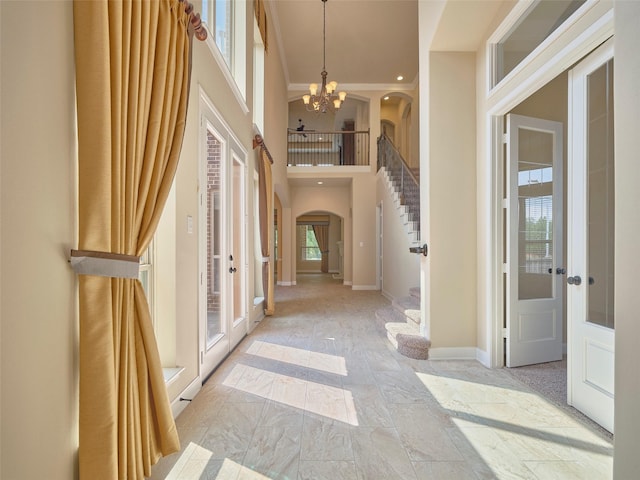 21315 Whistle Wood Dr, Richmond, TX 77406 - corridor featuring plenty of natural light, a high ceiling, arched walkways, and stairs