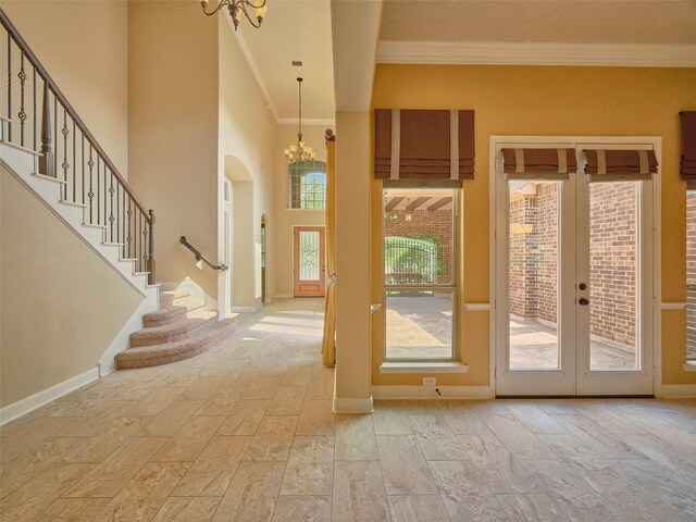 21315 Whistle Wood Dr, Richmond, TX 77406 - entryway with ornamental molding, a notable chandelier, french doors, and stairs