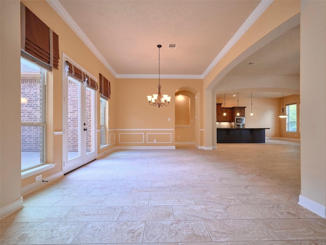 21315 Whistle Wood Dr, Richmond, TX 77406 - interior space featuring crown molding, arched walkways, an inviting chandelier, stone finish flooring, and visible vents