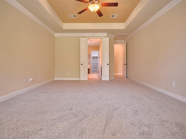 21315 Whistle Wood Dr, Richmond, TX 77406 - unfurnished bedroom with a raised ceiling, visible vents, light colored carpet, and ornamental molding