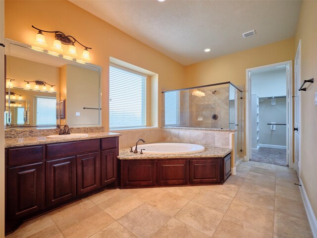 21315 Whistle Wood Dr, Richmond, TX 77406 - bathroom with a shower stall, a healthy amount of sunlight, a bath, and visible vents