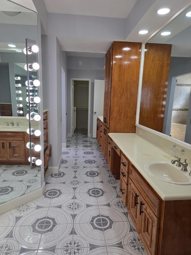 12203 Ashley Circle Dr E, Houston, TX 77071 - full bathroom with recessed lighting, two vanities, baseboards, and a sink
