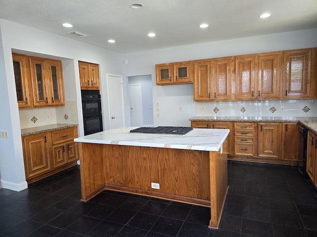 12203 Ashley Circle Dr E, Houston, TX 77071 - kitchen featuring brown cabinets, tasteful backsplash, visible vents, and black appliances