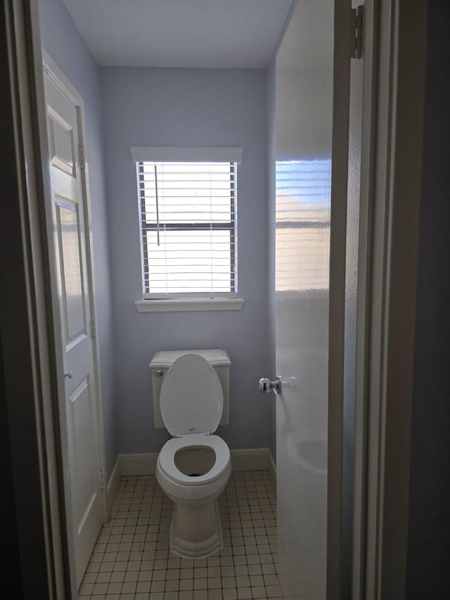 12203 Ashley Circle Dr E, Houston, TX 77071 - bathroom with tile patterned floors, baseboards, and toilet
