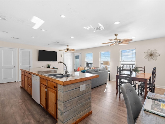 kitchen featuring dishwasher, ceiling fan, a sink, and visible vents